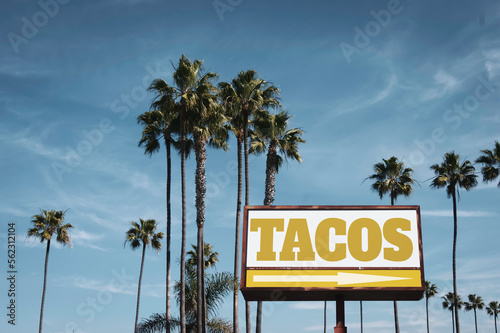 Aged and worn tacos sigh with palm trees