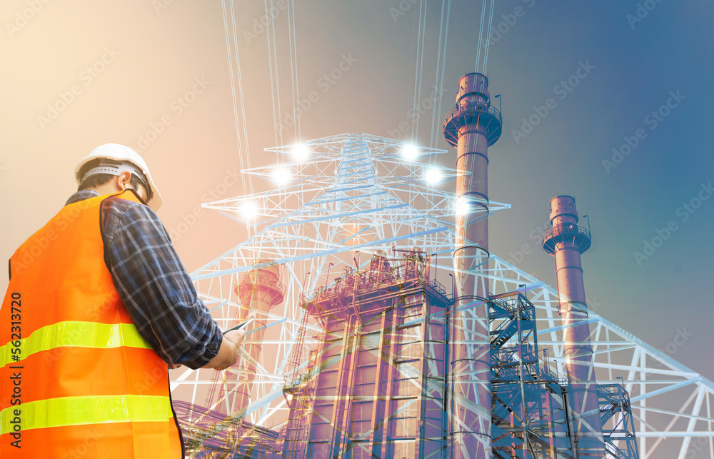 engineer checking large high-voltage poles and power plants