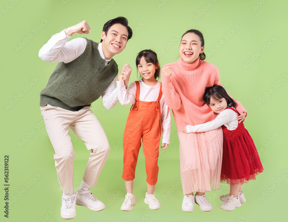 Fototapeta premium Image of young Asian family on background