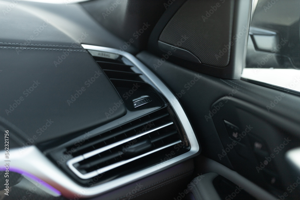 Luxury car air conditioning system intakes at the panel