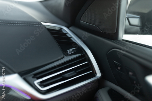 Luxury car air conditioning system intakes at the panel © Moose