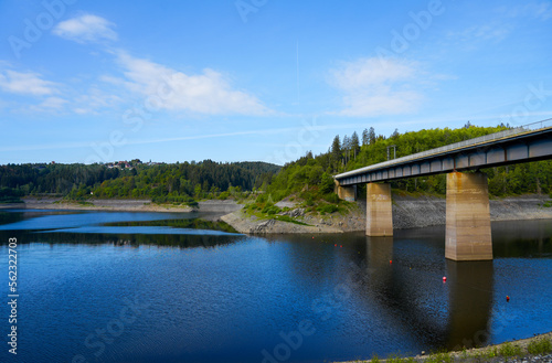 Oker reservoir near Altenau in the Harz Mountains. View from the Okertalsperre to the Oker See and the surrounding landscape. Idyllic nature by the water. 