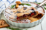 Pie with nuts, cinnamon and berry jam.