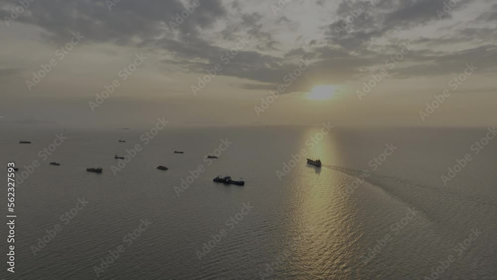Seascape and silhouette container ship floating in sea and over the sunlight background, 4k video Seascape and silhouette container ship floating in sea and over the sunlight background, 4k video