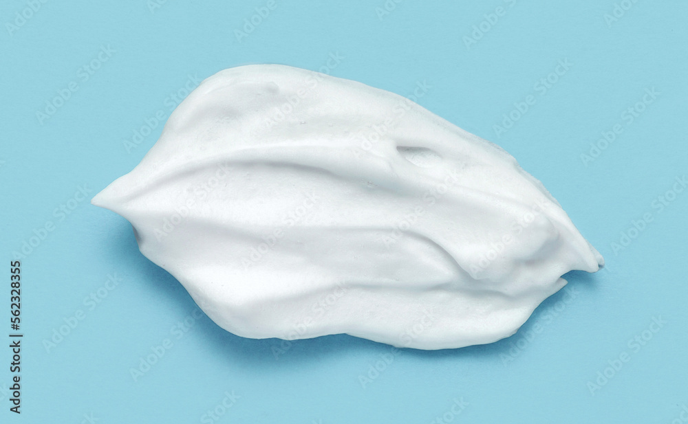 Shaving cream isolated on blue color background Shaving cream isolated on blue color background