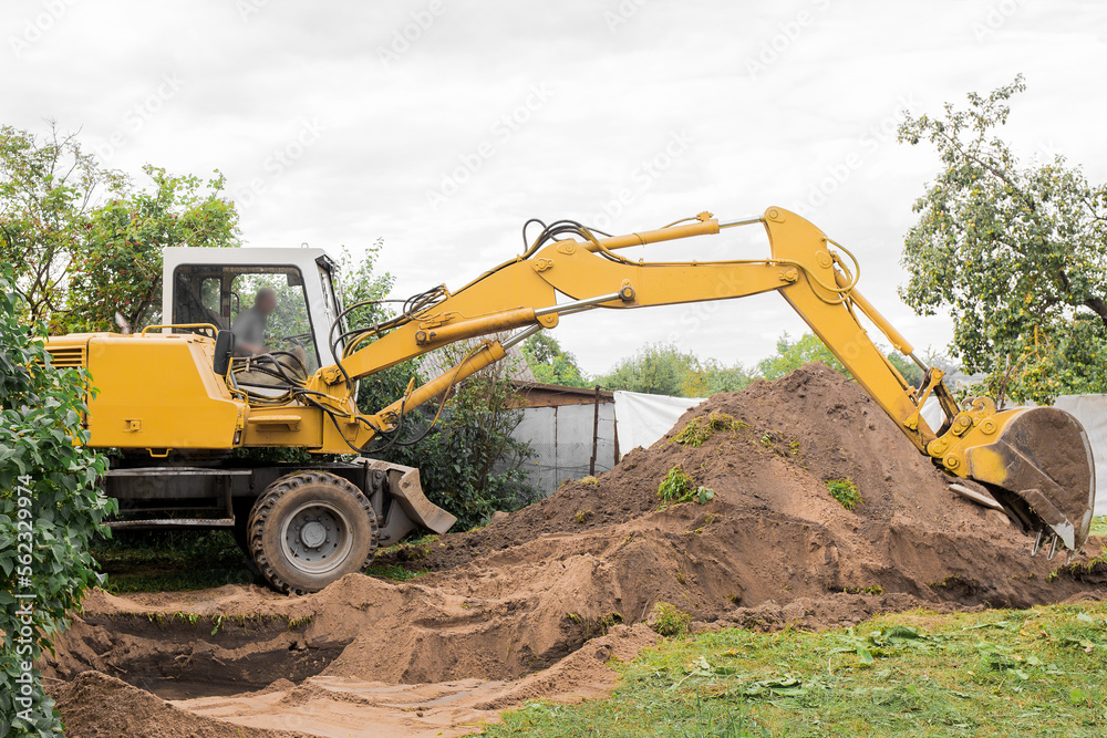 Obraz premium A excavator is digging on outdoors in an industrial site. Excavation works