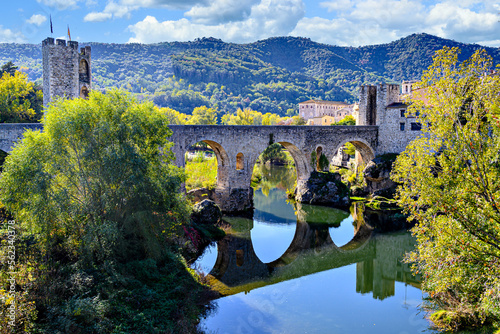 Famous medieval bridge over the river Fluvia in the medieval village de Besalú, Girona, Catalonia, Spain	 photo