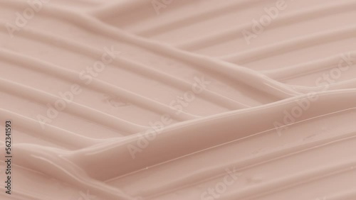 Macro crane shot of beige moisturizing cream with niacinamide and vitamin B5 wave texture | Moisturizing cream background shot for its commercial photo