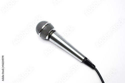 Silver handheld microphone with ball head isolated on a white background.