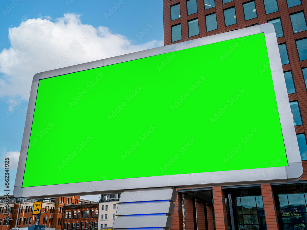 Large Green Screen Advertising Board - City Street scene showing high street and transport hub with billboard for targeted ads towards commuters and shoppers