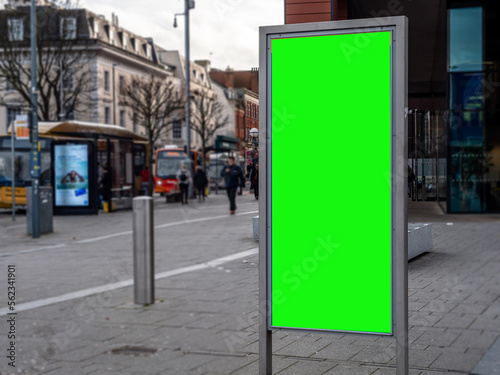 Large Green Screen Advertising Board - City Street scene showing high street and transport hub with billboard for targeted ads towards commuters and shoppers