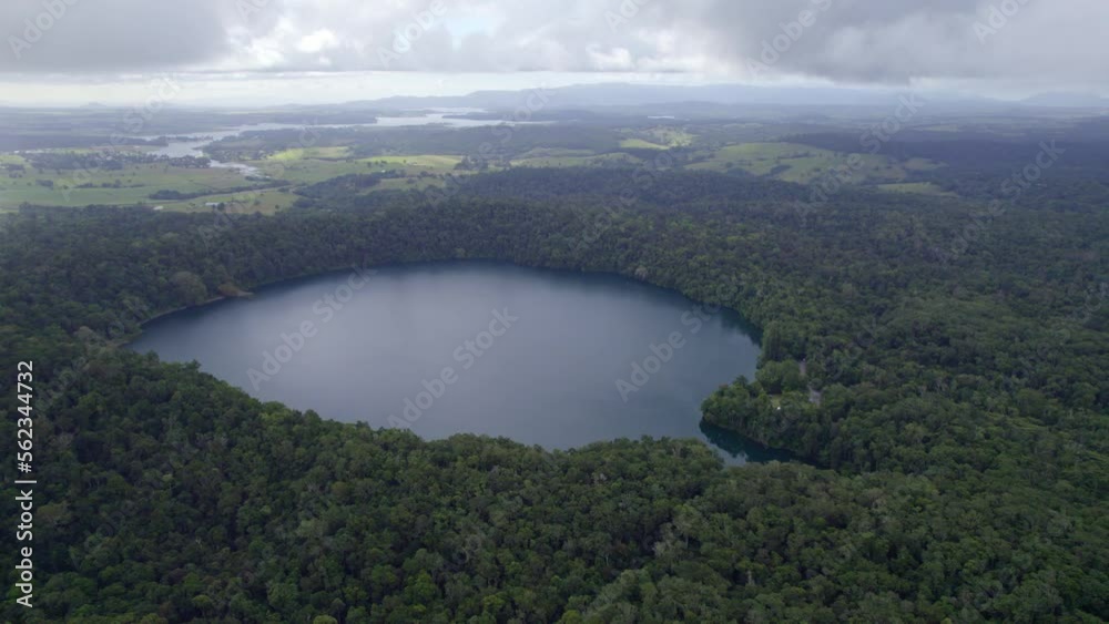 Idyllic Scenery Of Lake Eacham In Atherton Tableland, Queensland, Australia - aerial drone shot Idyllic Scenery Of Lake Eacham In Atherton Tableland, Queensland, Australia - aerial drone shot