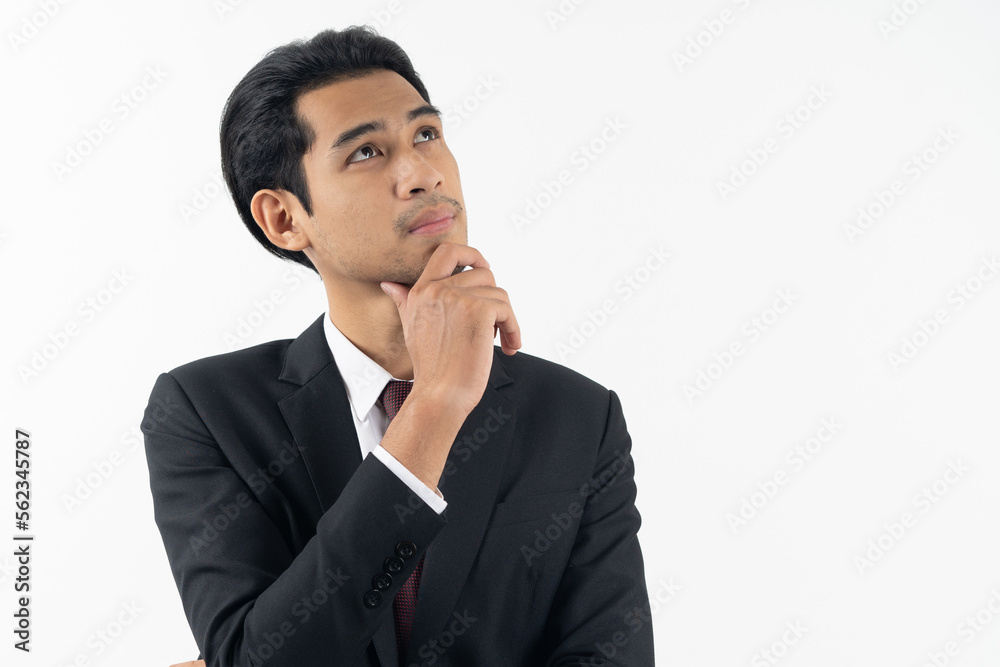 happy young asian businessman smiling and thinking in formal suit isolated on white background. happy young asian businessman smiling and thinking in formal suit isolated on white background.