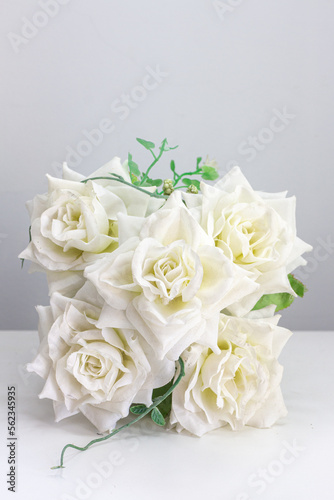 White roses on the table for special occasions to decorate your desk.