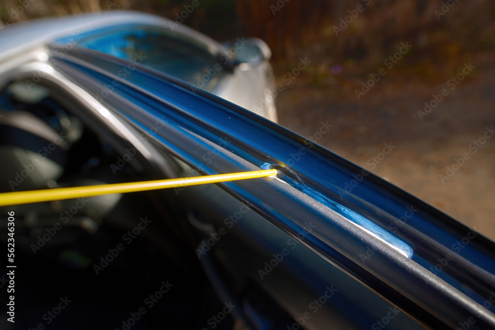 Silicone spray, coating car rubber elements before winter. Lube door  channels, ptotect in cold weather. Spraying silicone grease on weather  stripping and seals, prevent frozen doo, window Stock Photo | Adobe Stock