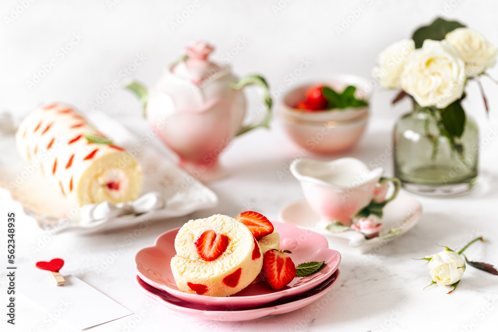 Homemade roll with strawberries, cream and mint leaves. Dessert on a white stone background. Selective focus. Homemade roll with strawberries, cream and mint leaves. Dessert on a white stone background. Selective focus.