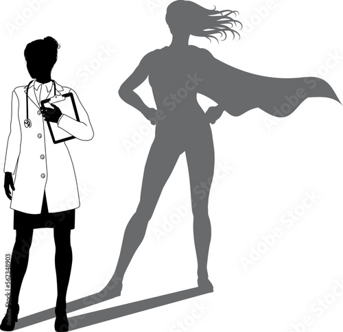 A superhero medical doctor woman health care worker revealed by her shadow silhouette as a super hero in a cape.