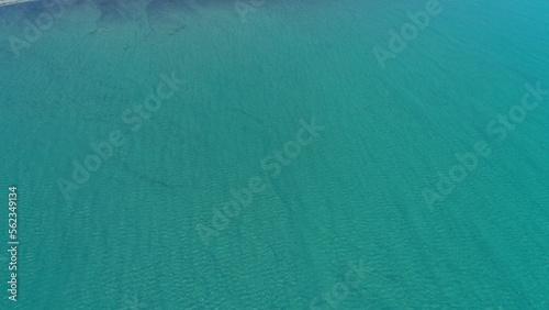 Top down aerial view over natural texture - abstract industrial lake water patterns. Turquoise waternature poluttion photo