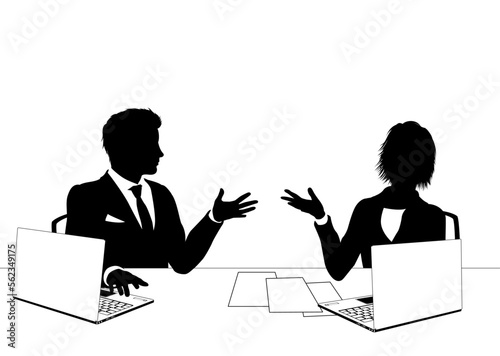 News anchor presenters or business people seated at a desk with laptops in silhouette