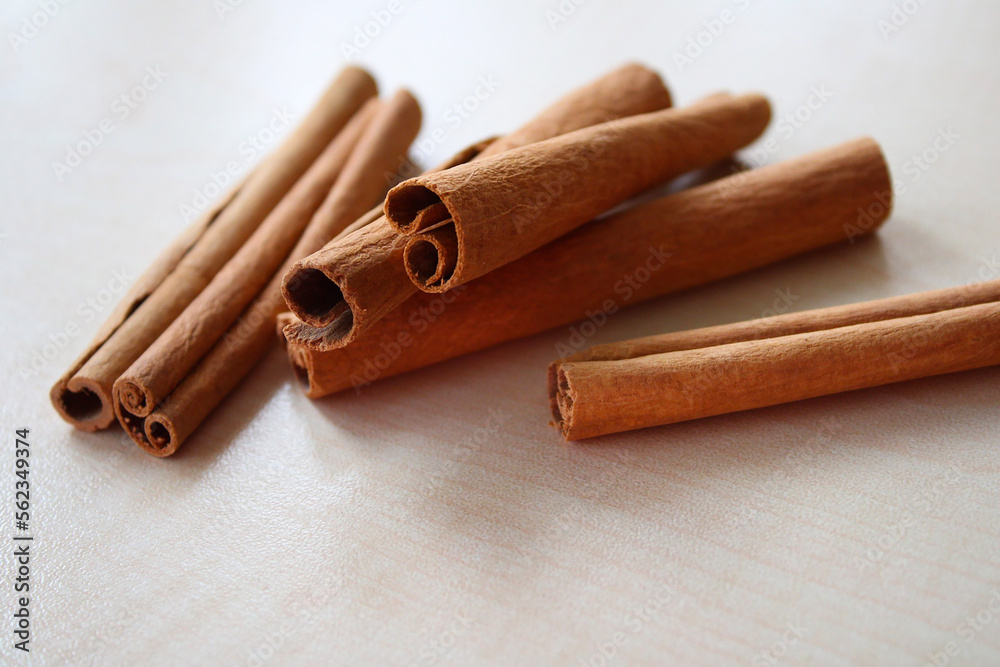 Fresh cinnamon sticks on a rustic wooden background Fresh cinnamon sticks on a rustic wooden background