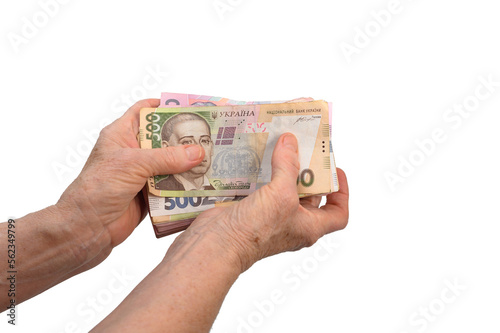An elderly woman holds money in her hands, © Olena Vasylieva