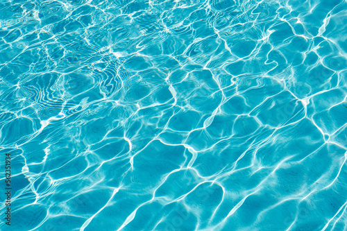 surface of blue swimming pool,background of water in swimming pool. © Volha