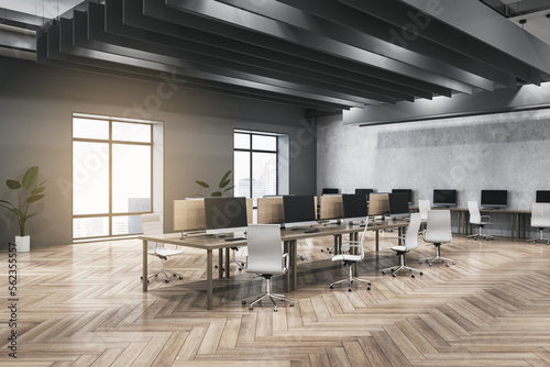 Clean dark concrete and wooden coworking office interior with furniture  equipment  window with city view and sunlight. Workplace and loft space concept. 3D Rendering.