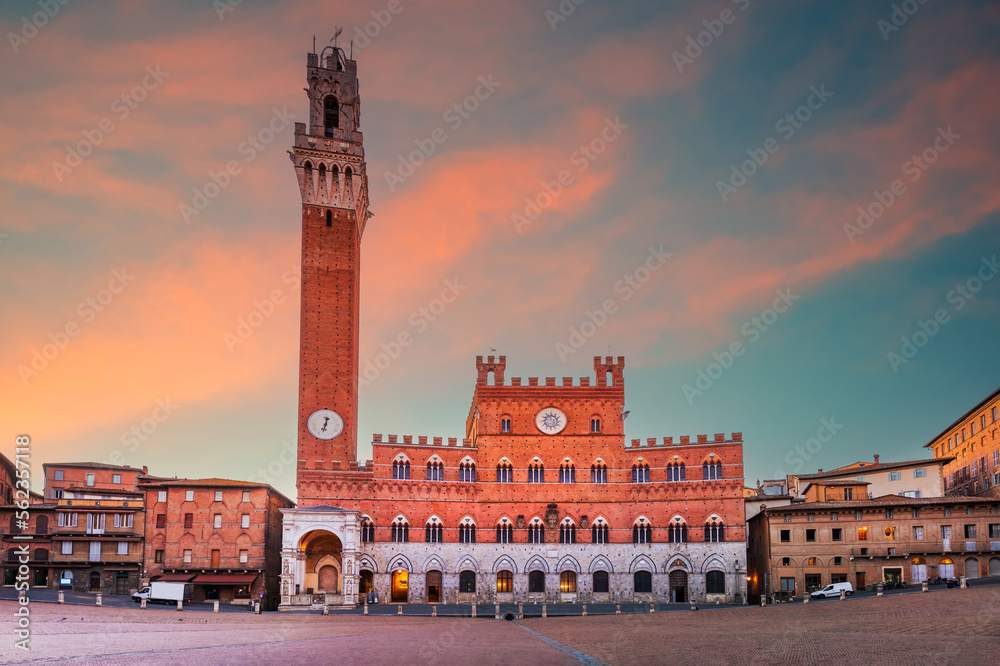 Siena, Italy - Piazza del Campo and the Mangia Tower, morning sunrise.