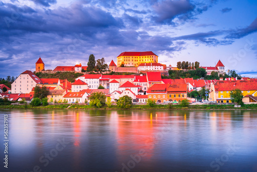 Ptuj, Slovenia. Beautiful sunset time over Drava River and oldtown, Styria historical region photo
