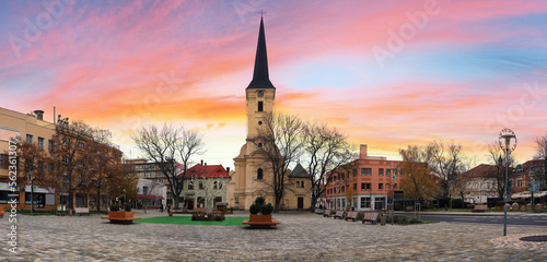 Center of the old town. Holy trinity and Roman Catholic Churchon the city plaza. Main square of city in southern Slovakia. Nove Zamky district. Nitra