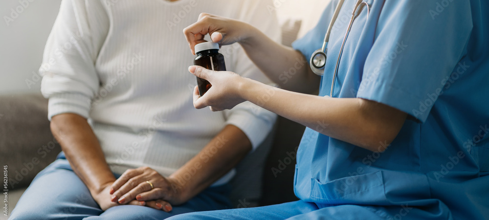 female therapist gives medication advice to an elderly patient. female therapist gives medication advice to an elderly patient.