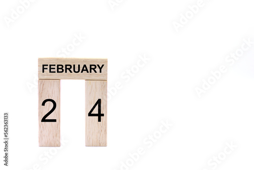 February 24 displayed wooden letter blocks on white background with space for print. Concept for calendar, reminder, date. 