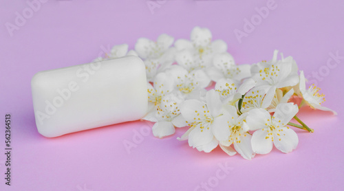 Mock up soap with flowers on pink background