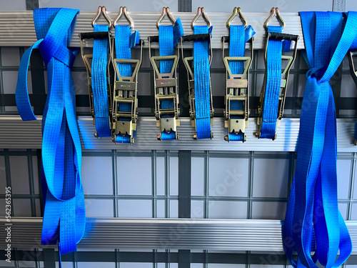 Tie-down straps for securing semi-trailer loads in close-up