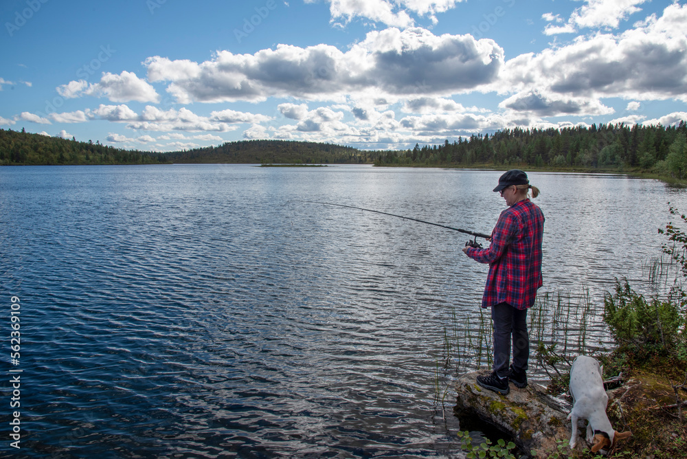 Woman fishing on the lake