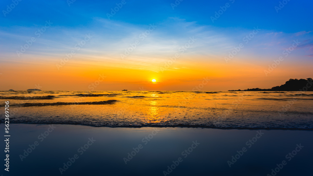 Beautiful sunrise on the beach and sea Holiday Vacation concept