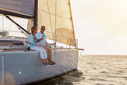 Relax, travel and luxury with couple on yacht for summer, love and sunset on Rome vacation trip. Adventure, journey and vip with man and woman sailing on boat for ocean, tropical and honeymoon at sea