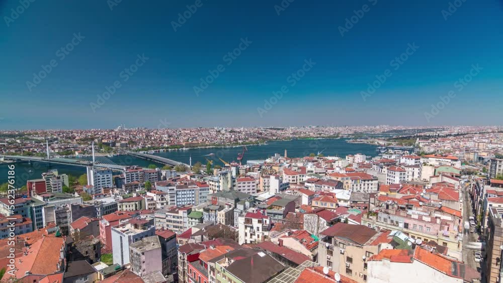 The view from Galata Tower to Galata Bridge timelapse which is connected Beyoglu region and Sultanahmet on the opposite shores of Golden Horn, Istanbul, Turkey. Ferries traffic at sunny spring day