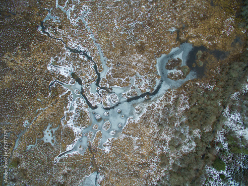 Aerial nadir view of wetland in Migdale Forest with frozen water