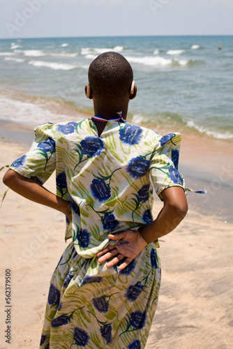 A teenager looks out to a brighter future across Lake Malawi, where waves have a sound for the first time and new hope abounds. photo