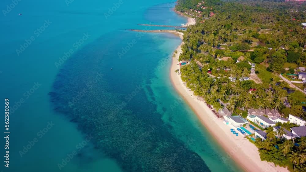 4K Aerial Front View of Surin Beach, Phuket. Beach, sea, sand and palms. Drone view of a beautiful white tropical sand beach on a summer day. Top view empty and clean beach. Phuket, Thailand. 4K Aerial Front View of Surin Beach, Phuket. Beach, sea, sand and palms. Drone view of a beautiful white tropical sand beach on a summer day. Top view empty and clean beach. Phuket, Thailand.