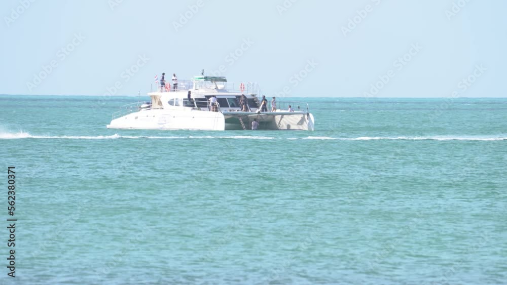 Catamaran and Jet Ski Rental At Sea In Thailand During Summer Day Catamaran and Jet Ski Rental At Sea In Thailand During Summer Day