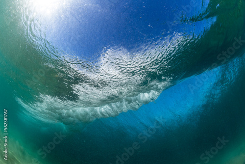 underwater world with a huge breaking wave