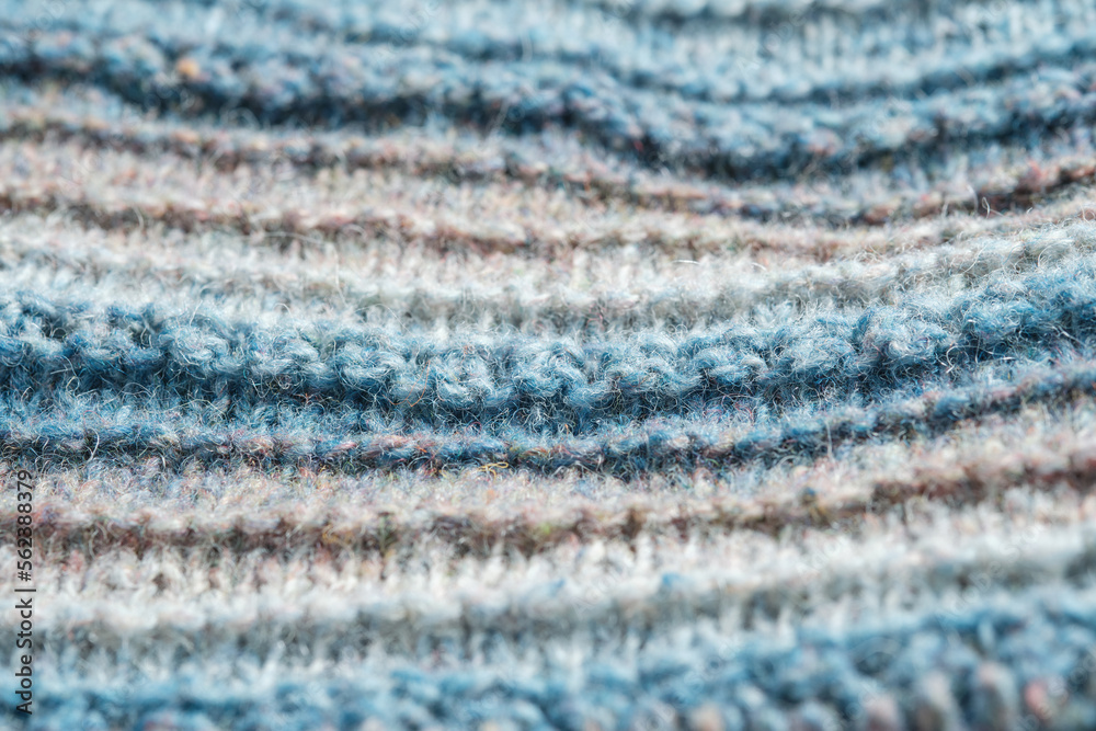 Knitted background. Knitted fabric texture, pure sheep wool, color gradient. Knitted background. Knitted fabric texture, pure sheep wool, color gradient.
