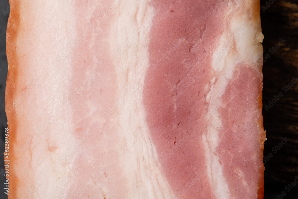 Bacon close-up macro photo. Smoked pork belly close-up.