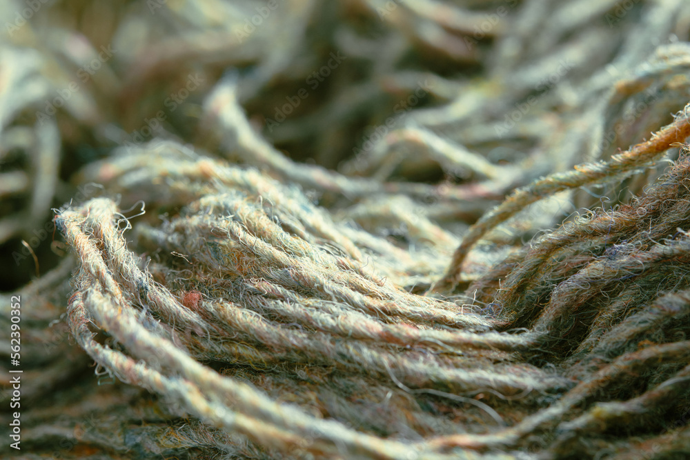 Threads of natural organic sheep wool. Unwound skein of olive green knitting yarn. Threads of natural organic sheep wool. Unwound skein of olive green knitting yarn.