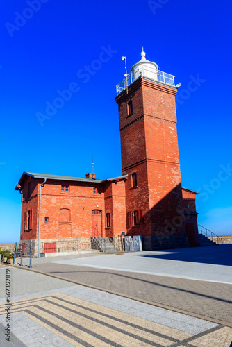 Old brick lighthouse at the Wieprza river mouth to the Baltic Sea in Darlowko, Poland