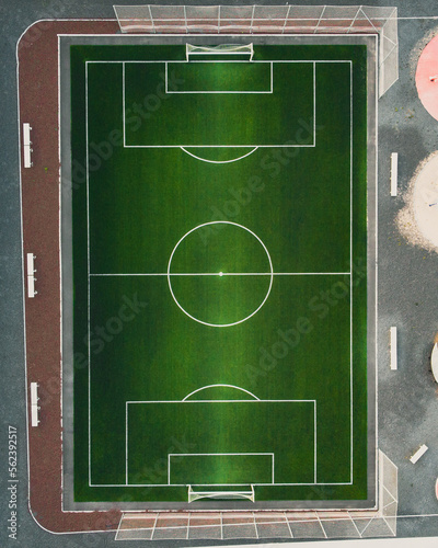 Aerial top down view of artifical grass football field.