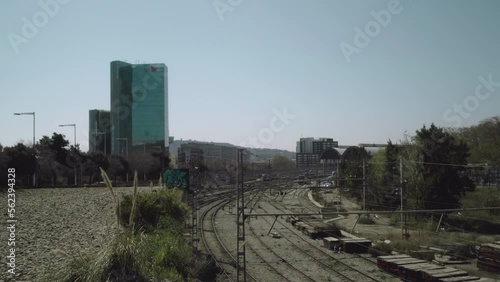 Old looking traintracks next to skyscraper