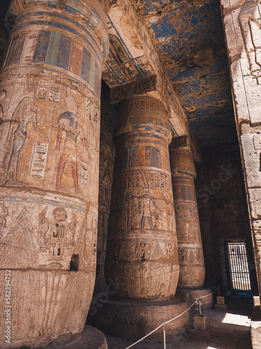 Colourful columns with hieroglyphs in Habu Temple, Luxor, Egypt.